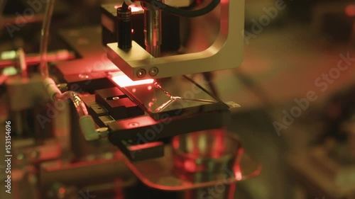 Touch Screen Production.
Production line of touch screen of mobile phone. Applying glue to stick the touch screen film to the glass module.
