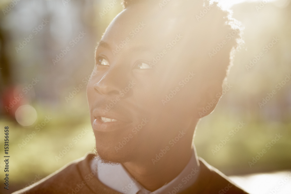 African american man portrait in sunny evening