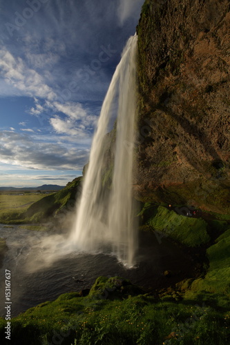 Seljalandsfoss waterfall plunging 60m from the cliff above, Sudhurland, Iceland
