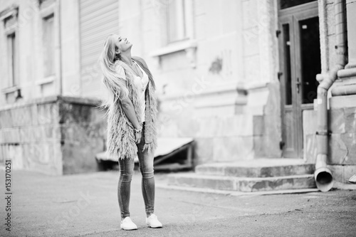 Wallpaper Mural Stylish blonde woman wear at jeans and girl sleeveless with white shirt against street. Fashion urban model portrait. Torontodigital.ca