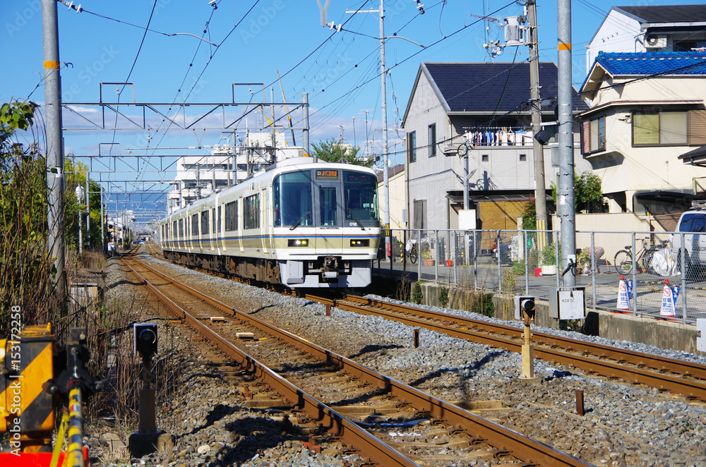 A train whistling through nearby residence A train whistling through nearby residence