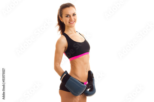 Fitness girl sports top sagged in the back looks into the camera and smiling © ponomarencko