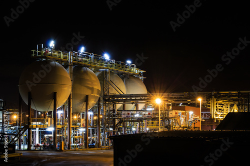 Hydrochloric acid tanks of petrochemical refinery at night. Tessenderlo, Flanders, Belgium, Europe