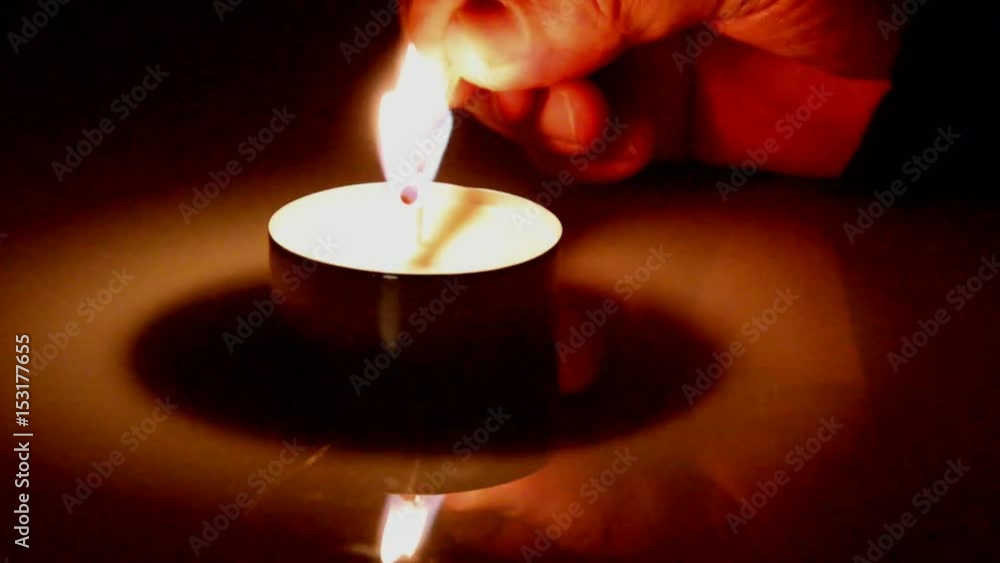 Men Hands Light a Candle With Matches on Dark Wooden Table Background Men Hands Light a Candle With Matches on Dark Wooden Table Background