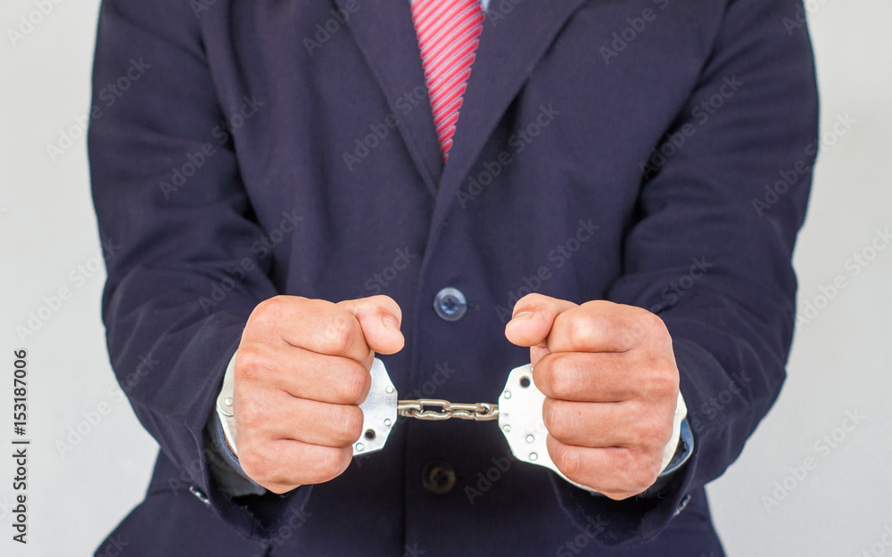 Arrested businessman,isolated on white background. Arrested businessman,isolated on white background.