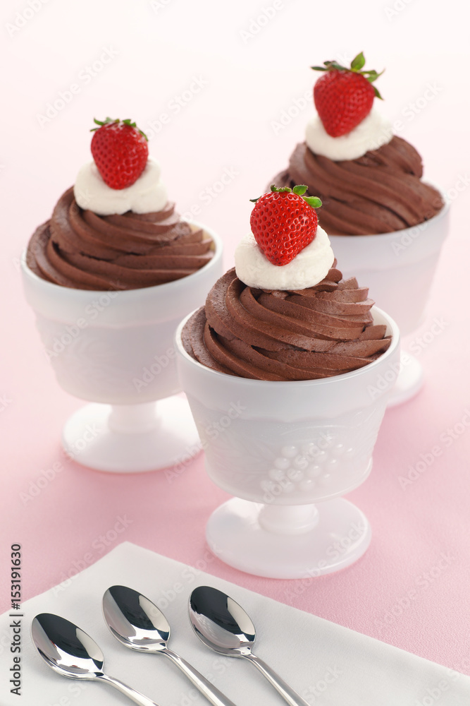 Three Chocolate Mousses with Whipped Cream Three Chocolate Mousses with Whipped Cream