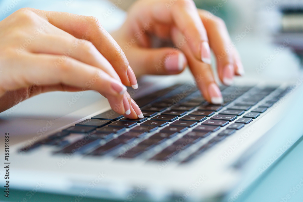 Woman office worker typing on the keyboard Woman office worker typing on the keyboard