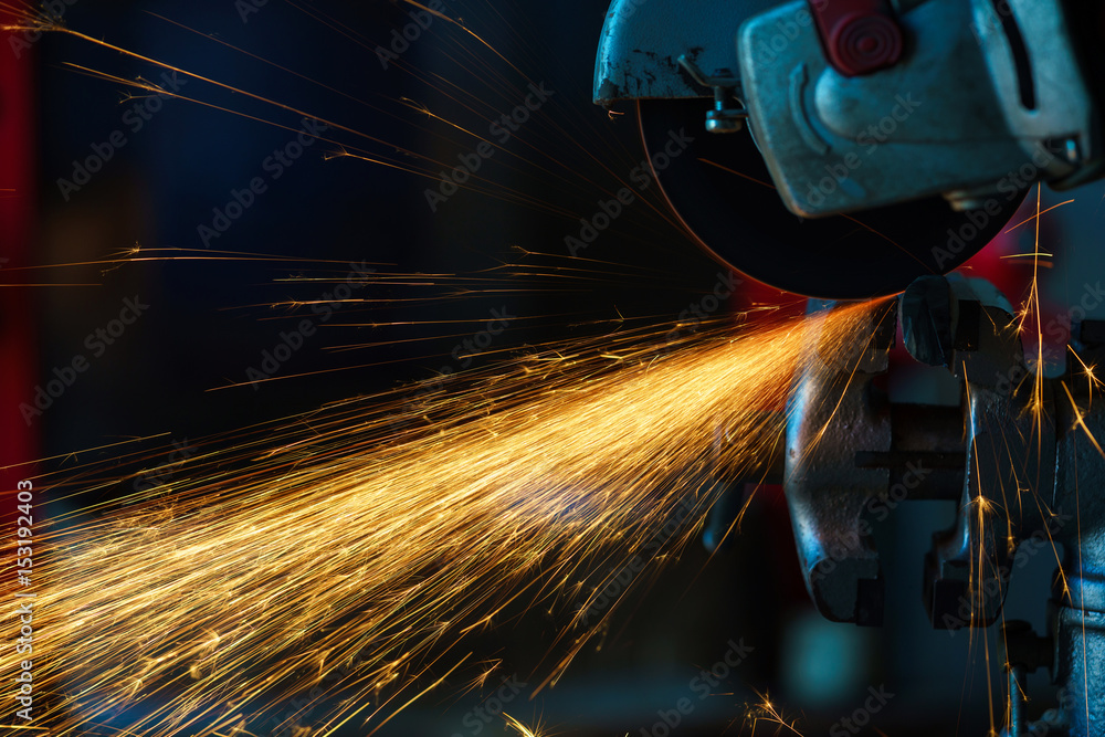 Angular grinding machine is cutting the metal and a lot of sparks Angular grinding machine is cutting the metal and a lot of sparks