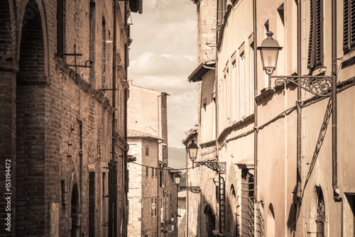 View of a street in the historic district of Colle Val d'Elsa a small town near Siena in Tuscany photo