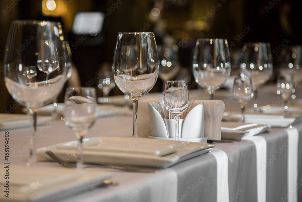 catering table set service with silverware, napkin and glass at restaurant before party