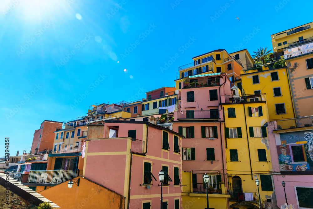 View of a street of the beautiful town Riomaggiore in Liguria, inside the famous Cinque Terre National Park.