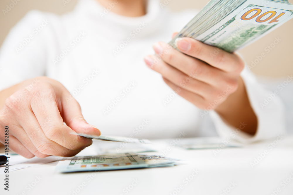 Hands counting money, close up Hands counting money, close up