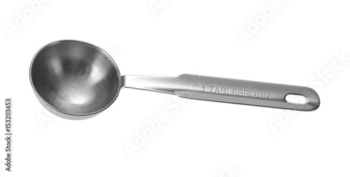 Metal measuring spoon tablespoon. Isolated on white background.