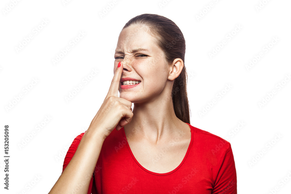 Portrait of liar woman in red t-shirt with freckles. looking up and touch her nose, studio shot. isolated on white background. Portrait of liar woman in red t-shirt with freckles. looking up and touch her nose, studio shot. isolated on white background.