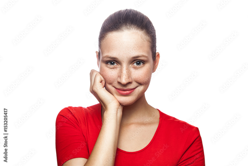 Portrait of happy smiley woman in red t-shirt with freckles. looking at camera, studio shot. isolated on white background. . Portrait of happy smiley woman in red t-shirt with freckles. looking at camera, studio shot. isolated on white background. .