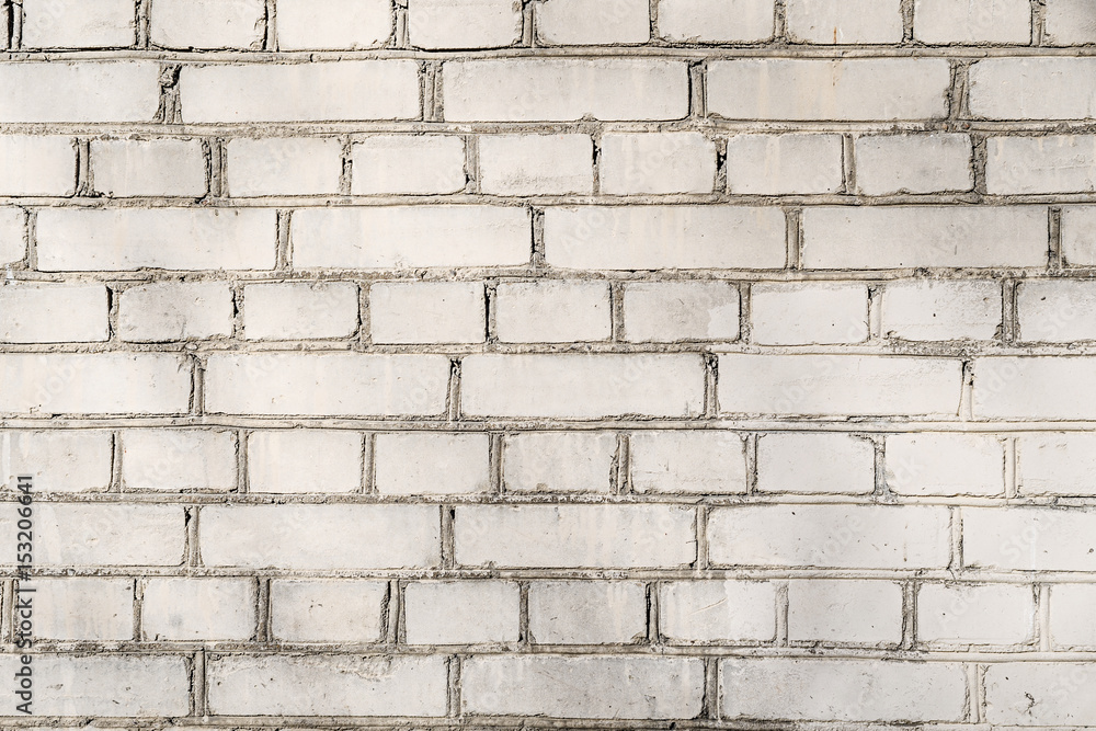 White wall made of white silicate bricks with cement for backgrounds and design