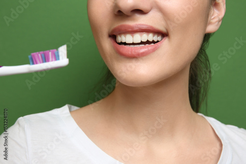 Young beautiful woman brush...