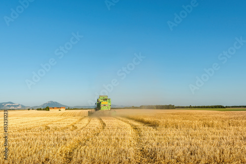 Harvester machine working in field © Vaceslav Romanov