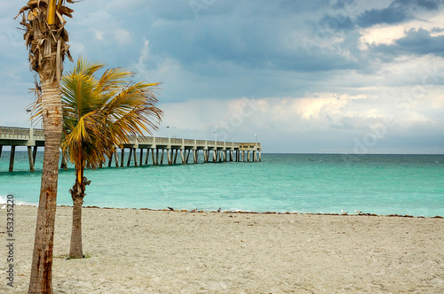 beautiful sky at the beach, pier in the background