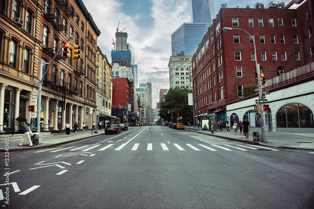 New York City street road in Manhattan at summer time. Urban big city life concept background.