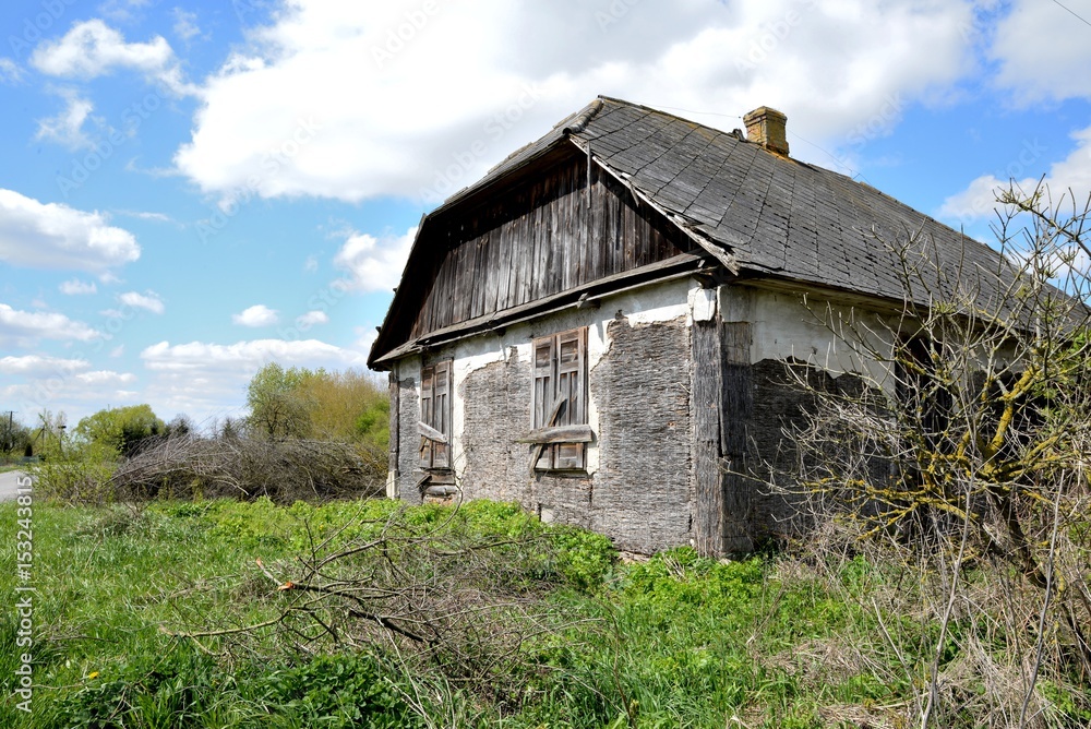 Old wooden abandoned house destroying the wasteland