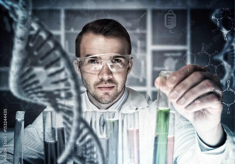 Young scientist mixing reagents in glass flask in clinical laboratory Young scientist mixing reagents in glass flask in clinical laboratory
