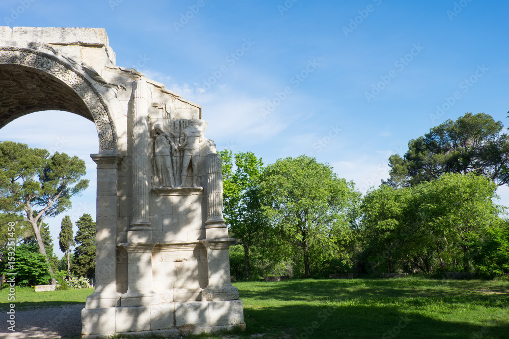 France, Saint Remy de Provence in Southern France, Glanum, The triumphal arch of Glanum (10-25 BC) 1921.Mausoleum of the Julii (about 40 BCE), in background. France, Saint Remy de Provence in Southern France, Glanum, The triumphal arch of Glanum (10-25 BC) 1921.Mausoleum of the Julii (about 40 BCE), in background.