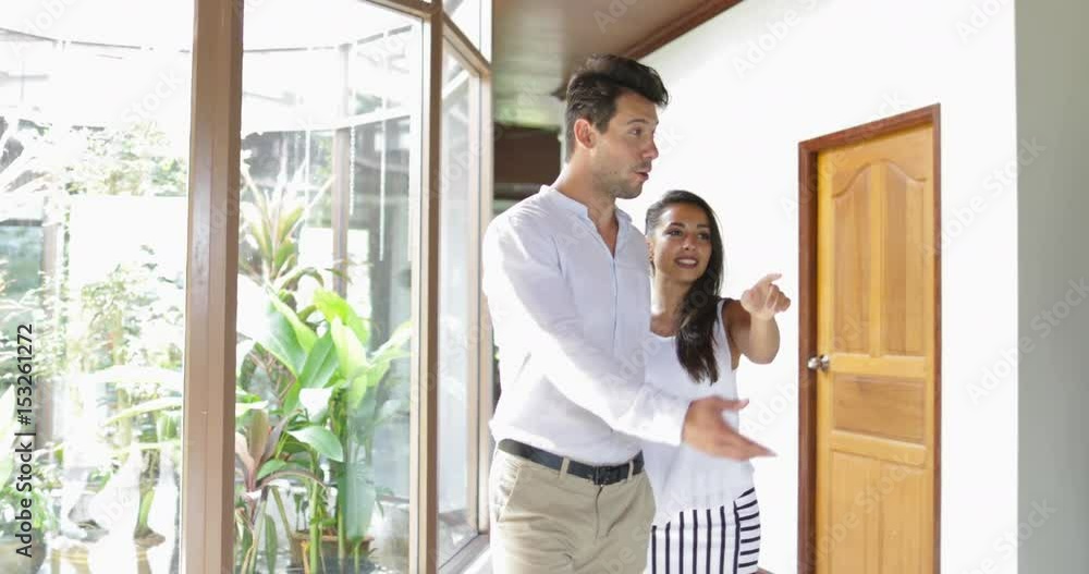 Young Couple Viewing Modern Apartment, Businessman Real Estate Agent House Interior To Buyers Man And Woman Slow Motion 60 Young Couple Viewing Modern Apartment, Businessman Real Estate Agent House Interior To Buyers Man And Woman Slow Motion 60