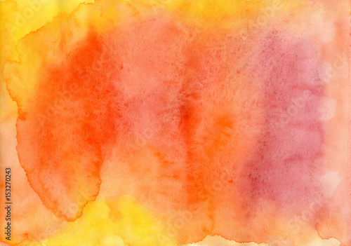 Background in orange and yellow tones painted in watercolor by hand on wet textured paper