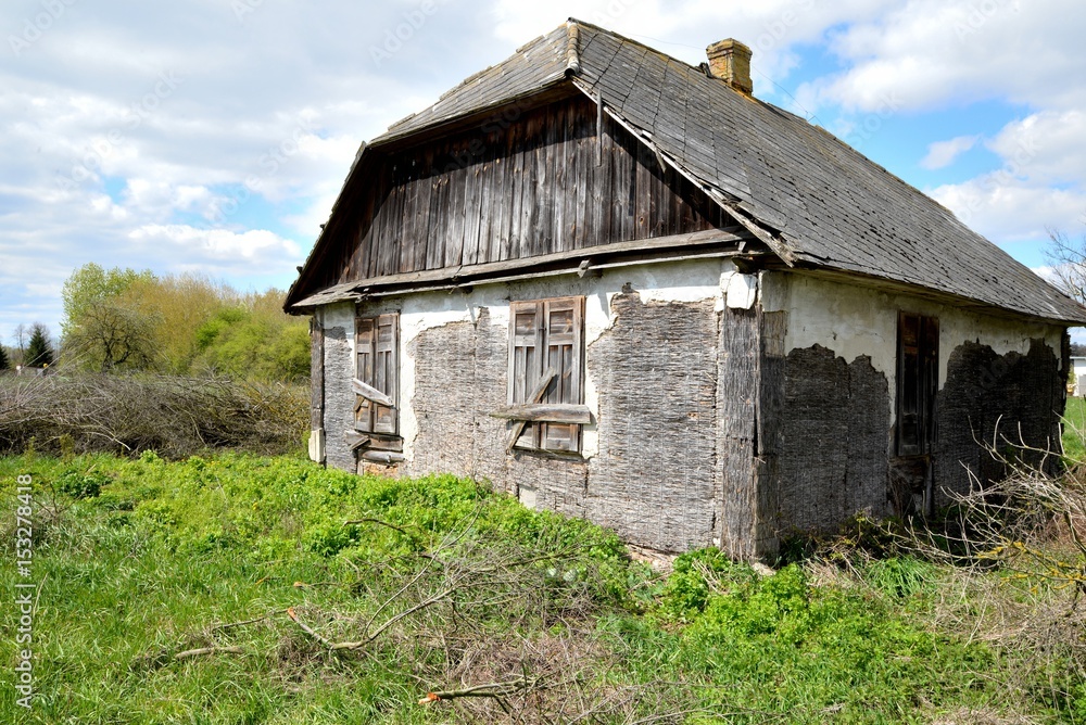 Old wooden abandoned house destroying the wasteland