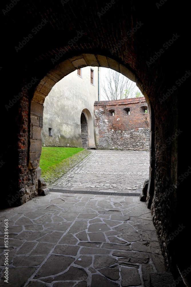 Medieval stone entrance gate to the Benedictine monastery in Tyniec