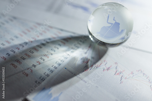 Obraz na plátně Glass globe with stock charts