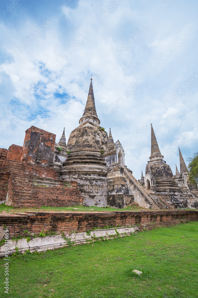 Ruins of buddha statues and pagoda of Wat Phra Si Sanphet in Ayutthaya historical park, Thailand