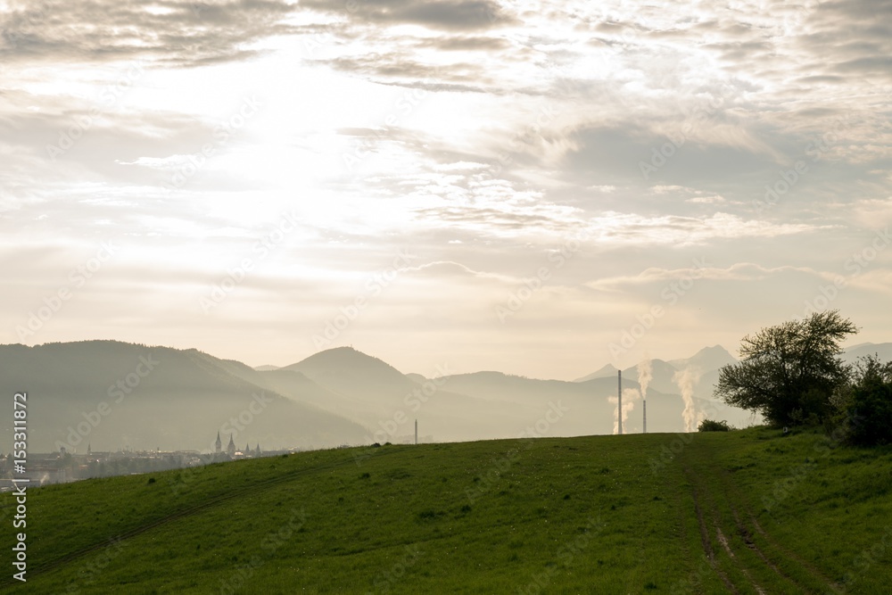 Fototapeta premium Sunrise and sunset over the hills and town. Slovakia