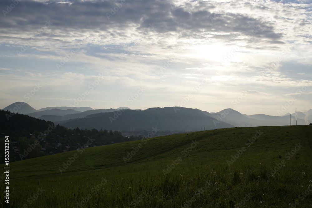 Fototapeta premium Sunrise and sunset over the hills and town. Slovakia