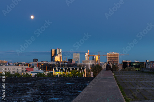 TALLINN, ESTONIA - AUGUST, 15, 2016: Aerial cityscape of modern business financial district with tall skyscraper buildings illuminated at night