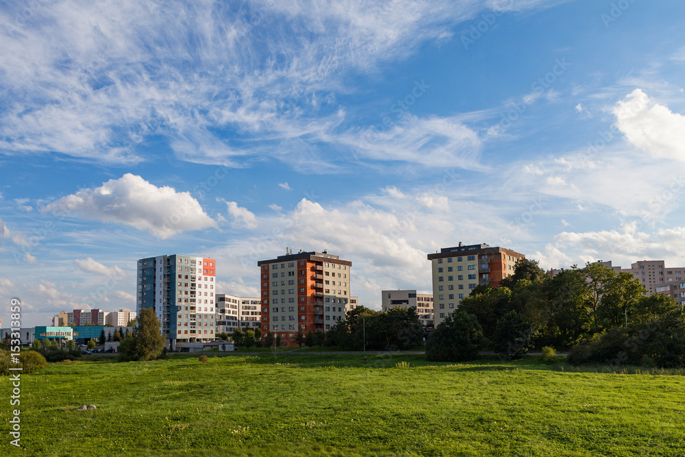 New modern blocks of flats in green area with blue sky at summer day. Northern friendly style. New modern blocks of flats in green area with blue sky at summer day. Northern friendly style.