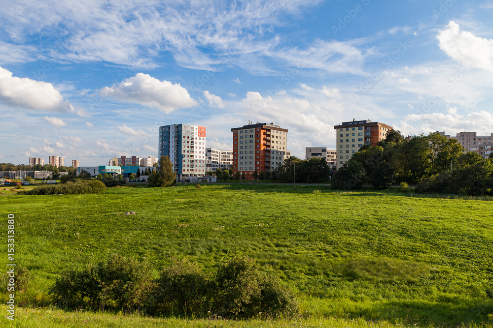 New modern blocks of flats in green area with blue sky at summer day. Northern friendly style. New modern blocks of flats in green area with blue sky at summer day. Northern friendly style.