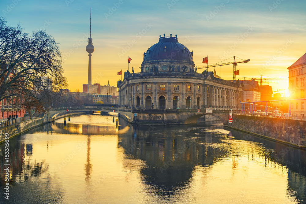 Museum Island on Spree river and TV tower in the background at sunrise, Berlin, Germany