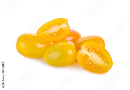 whole and half cut yellow cherry tomato on white background