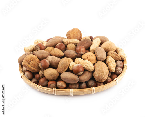 Wicker basket full of nuts isolated