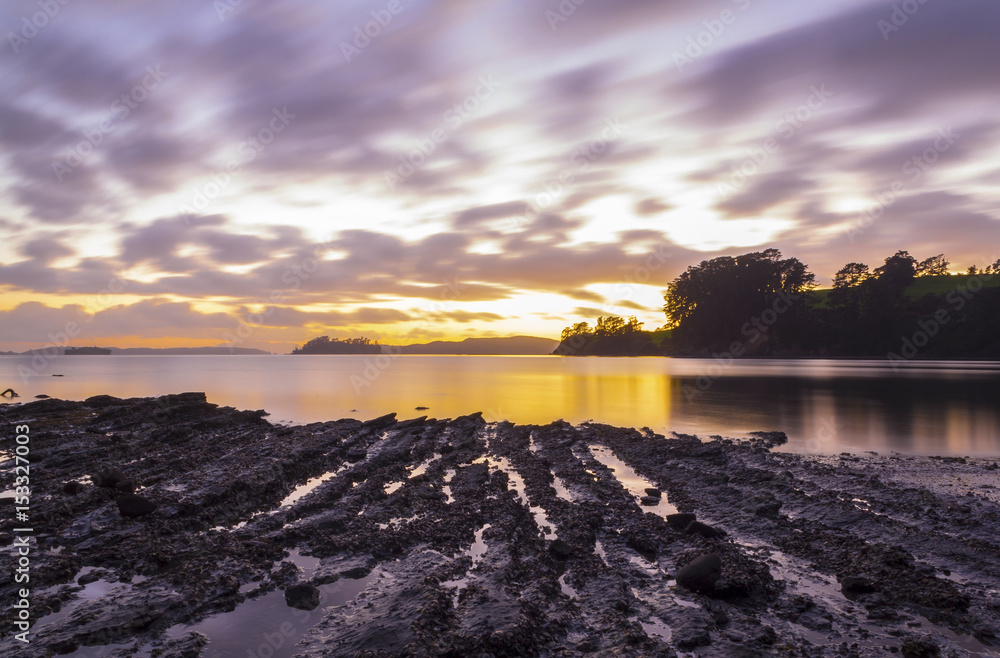 Sunrise Times During Low Tide at Scandrett Beach Auckland, New Zealand.