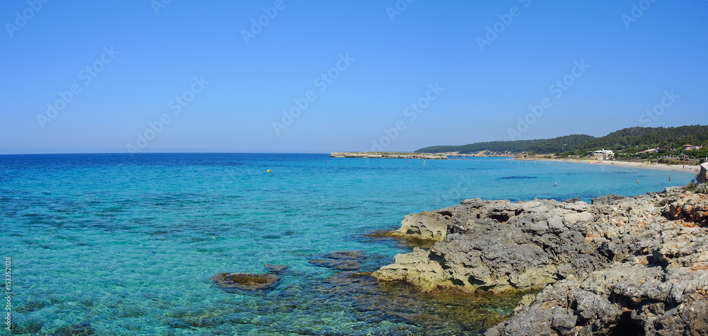 Landscape of the beautiful beach of Saint Tomas with a wonderful turquoise sea, Menorca, Spain
