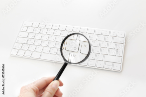 Laptop with a magnifying glass