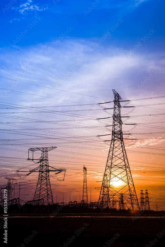 Fototapeta premium The silhouette of high voltage towers