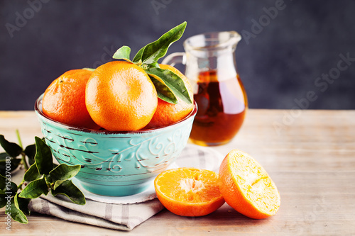 Tangerines Fruit with Green Leaves on Vintage Background