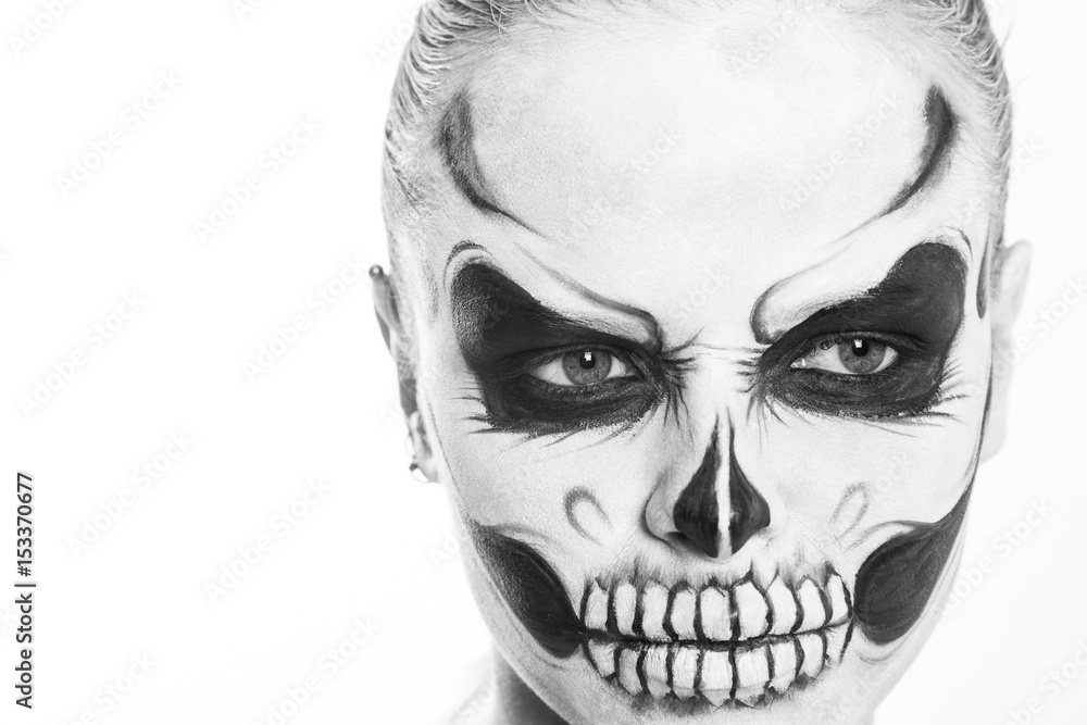 Girl with creative halloween face art on white background. Girl with creative halloween face art on white background.