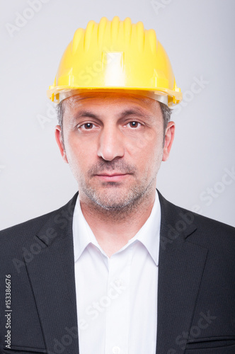 Portrait of handsome engineer wearing hardhat