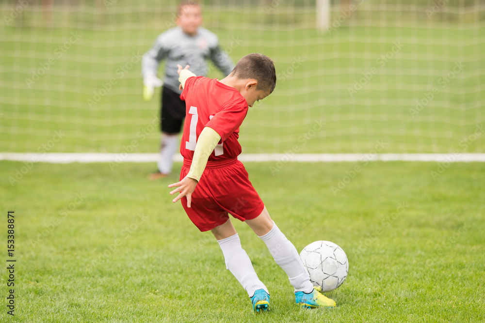 Kids soccer football - children players match on soccer field