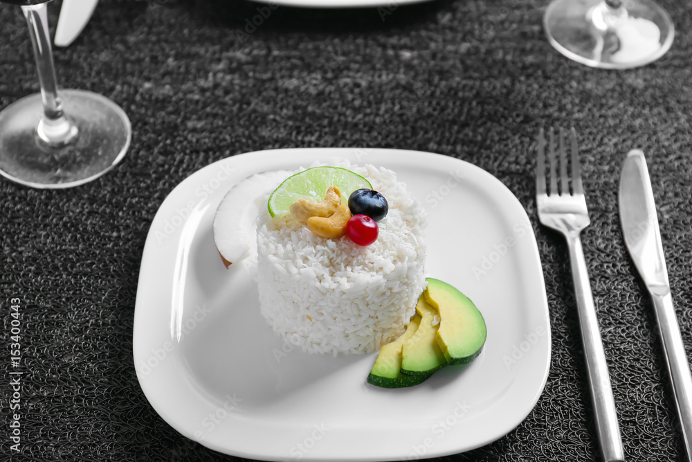 Plate with delicious tasty coconut rice on table Plate with delicious tasty coconut rice on table
